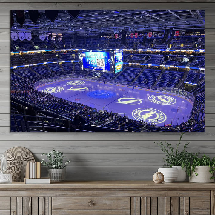 The wall art canvas print at Amalie Arena features team logos on ice, encapsulating the vibrant atmosphere of an NHL hockey stadium.