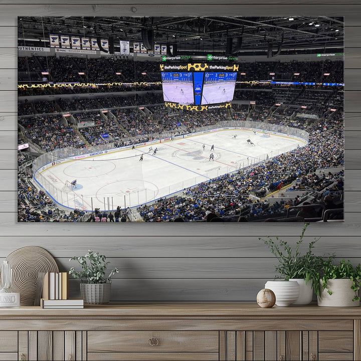 A large Enterprise Center canvas of a crowded hockey arena hangs prominently.