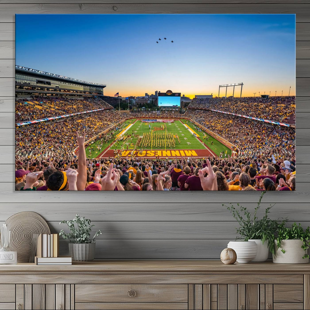 Canvas wall art featuring the University of Minnesota Football Team print, showcasing Huntington Bank Stadium at sunset with jets overhead.