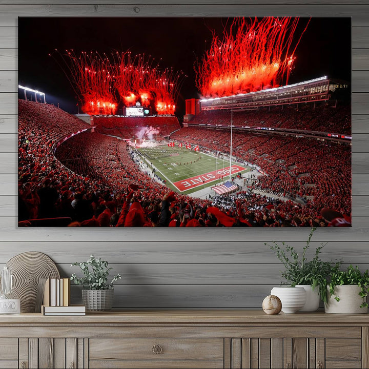 A vibrant red canvas art of a packed Ohio State Buckeyes stadium at night with fireworks.