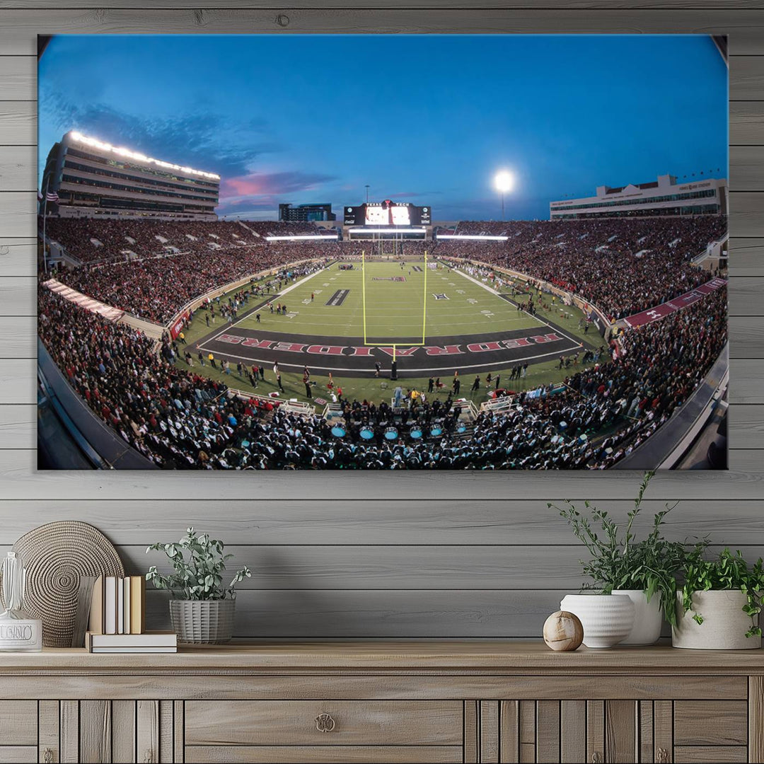 The wall art in the living room features a Texas Tech Red Raiders Football Team Print, showcasing Jones AT&T Stadium at dusk.