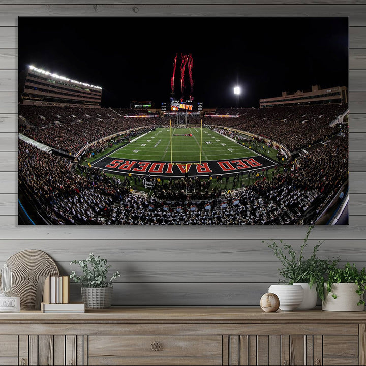 The wall features a Texas Tech Red Raiders Football Team Print on canvas, showcasing fireworks over a packed stadium at night.