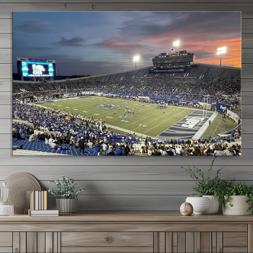 A Memphis Tigers football canvas print of Simmons Bank Liberty Stadium at sunset enhances the living room.