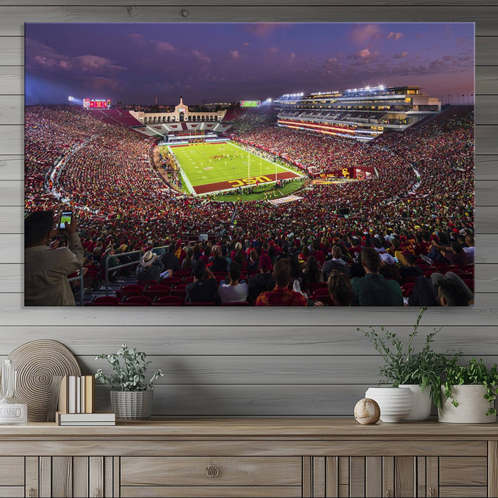 The vibrant wall art canvas print captures the USC Trojans playing under lights at dusk in LA Memorial Coliseum.