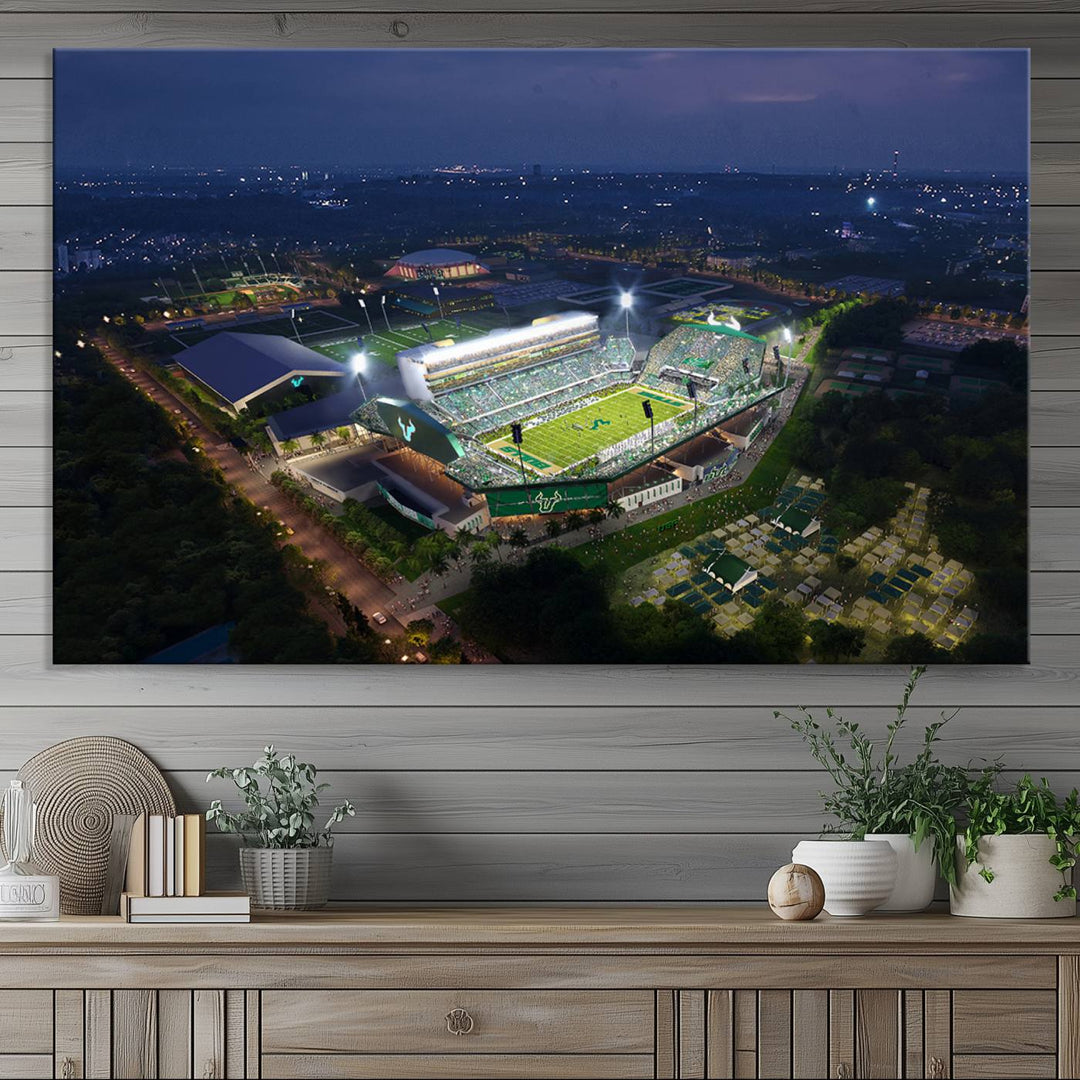 The USF Bulls Football Team Wall Art Canvas Print showcases the Tampa USF Football Stadium at night with city lights.