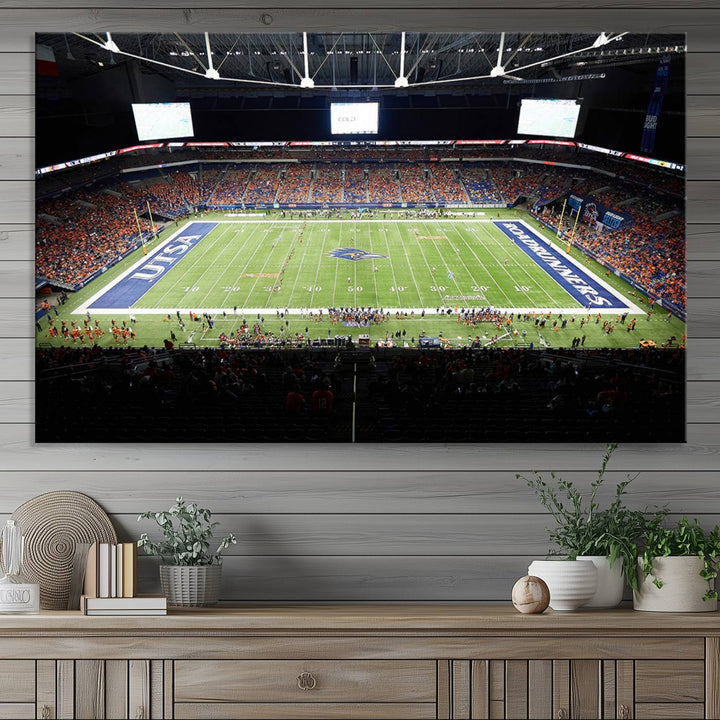 The UTSA Roadrunners game at Alamodome canvas print captures the scene from above, displaying fans and the UTSA lettering on the field.