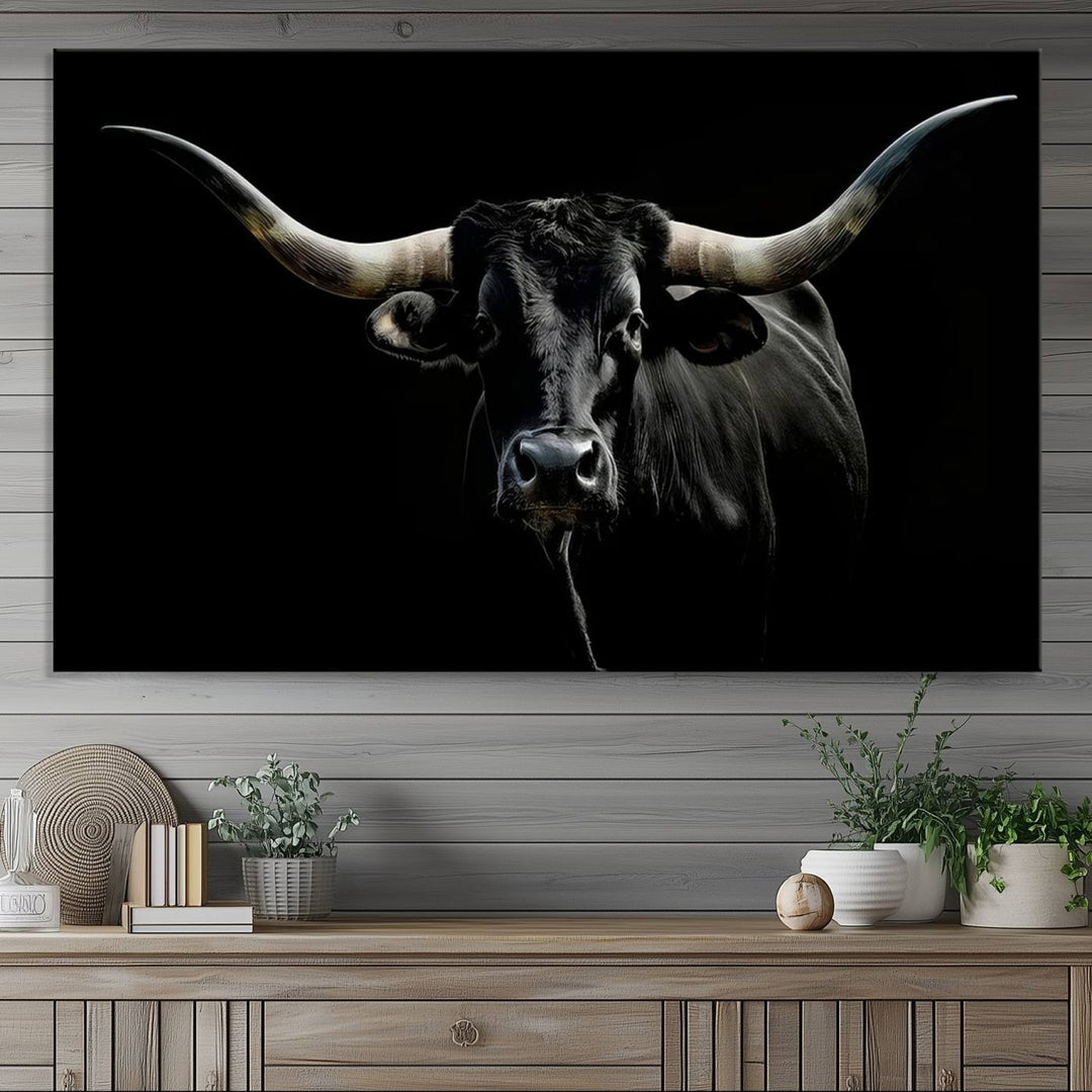 The Texas Black Longhorn Bull Canvas Print, featuring large curved horns set against a dark background, is ideal for Western decor.