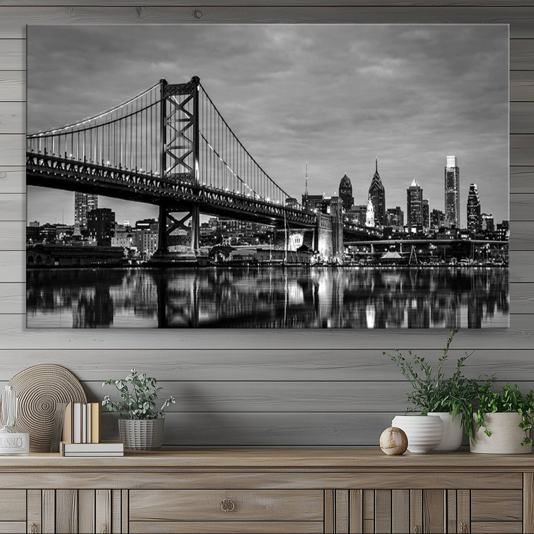 The "Large Wall Art Philadelphia Canvas Print" showcases a black-and-white depiction of the Ben Franklin Bridge with a water reflection.