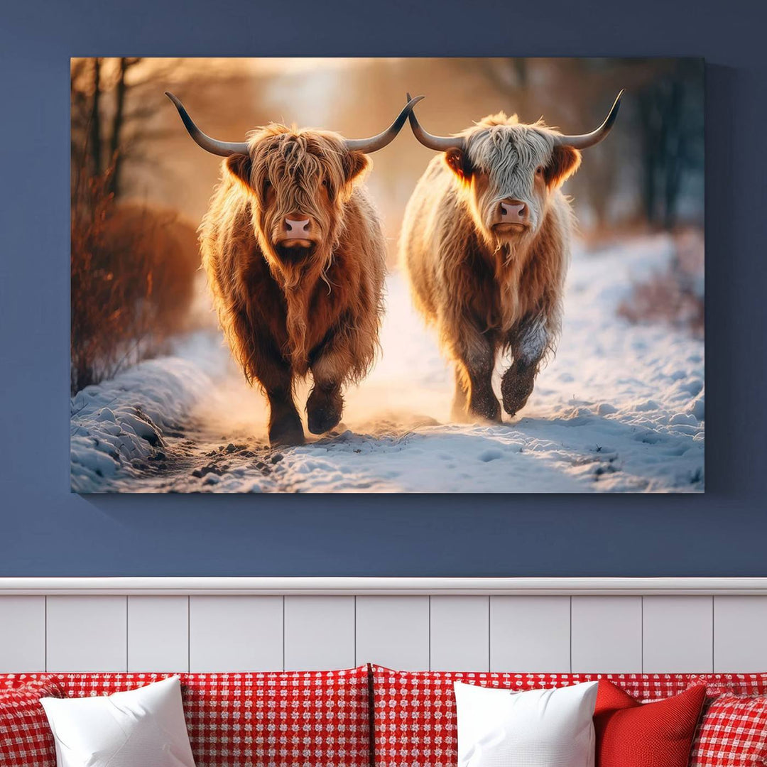 The wall art is a Scottish Highland Cow Horn canvas print featuring cows on a snowy path bathed in warm sunlight, serving as a rustic decor piece.