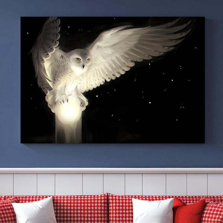 The Night Owl Art graces the wall with its depiction of a snowy owl on a glowing orb, perfect for modern decor.