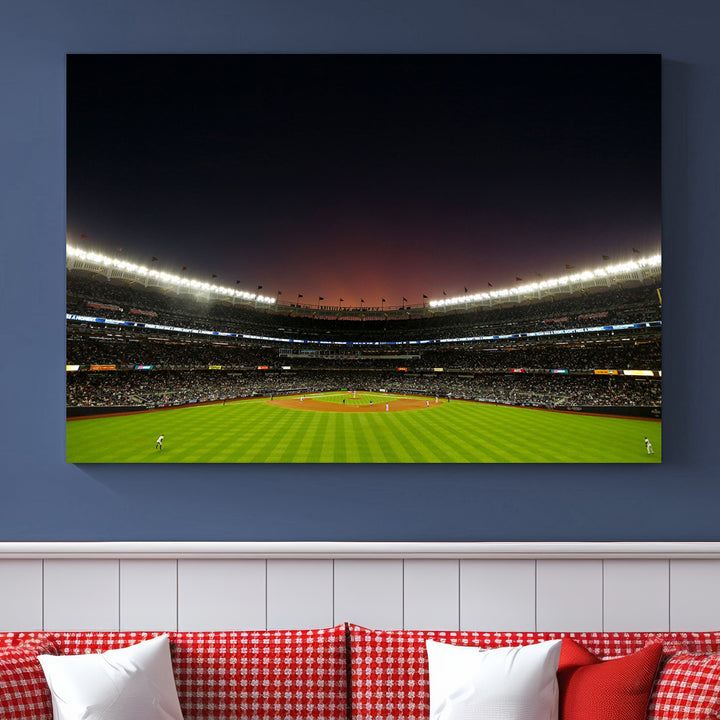 A night game at Yankee Stadium depicted on canvas beneath a sunset sky.