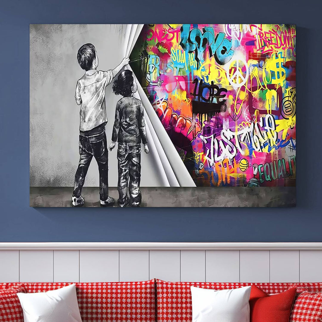 The Banksy Print - Street Art Canvas features a vibrant and bold image of two children lifting a curtain to reveal colorful graffiti. It's ready to hang, adding an urban modern decor vibe.