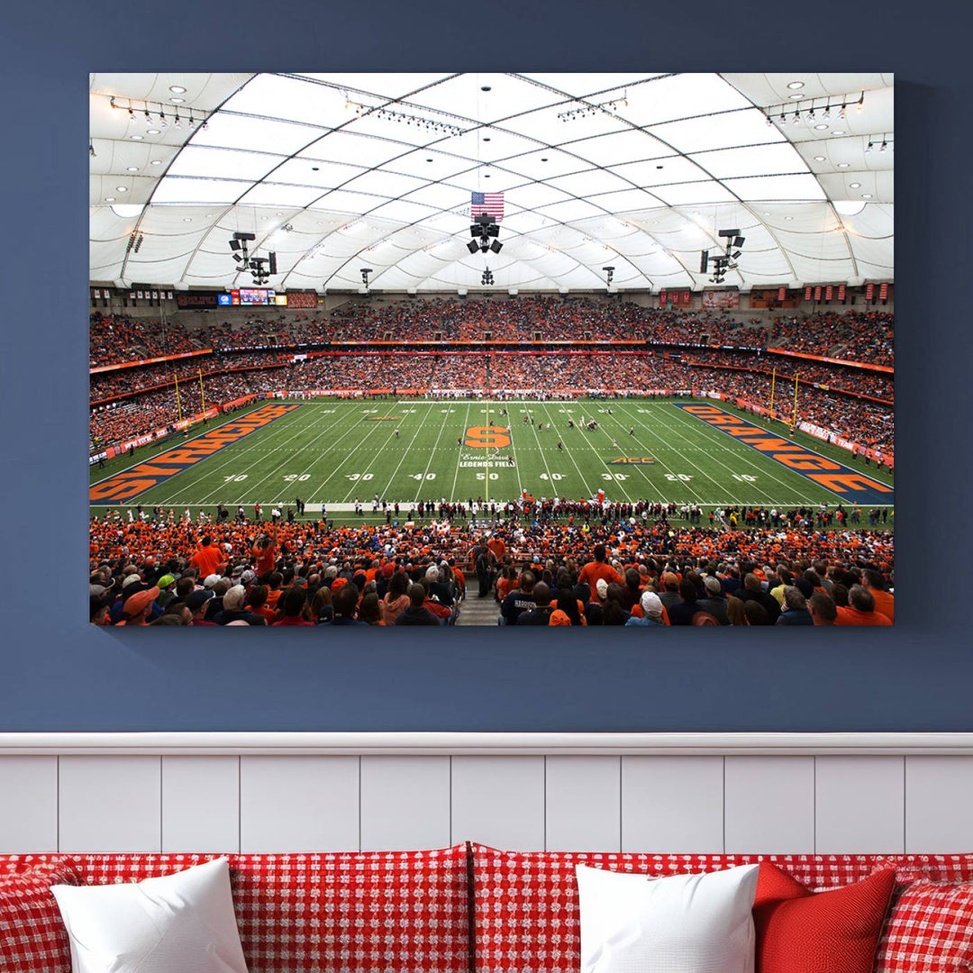 Fans fill the Syracuse JMA Wireless Dome, highlighted in orange and blue under a vaulted roof on this premium canvas print of the scene.