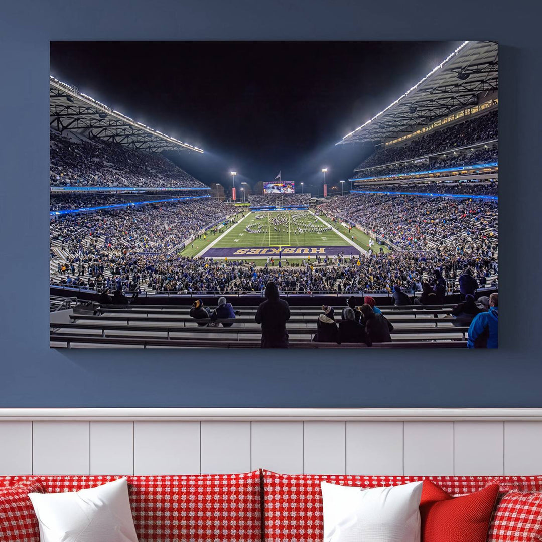 A canvas print titled The University of Washington Huskies Football depicts a packed Husky Stadium at night, as seen from the stands.