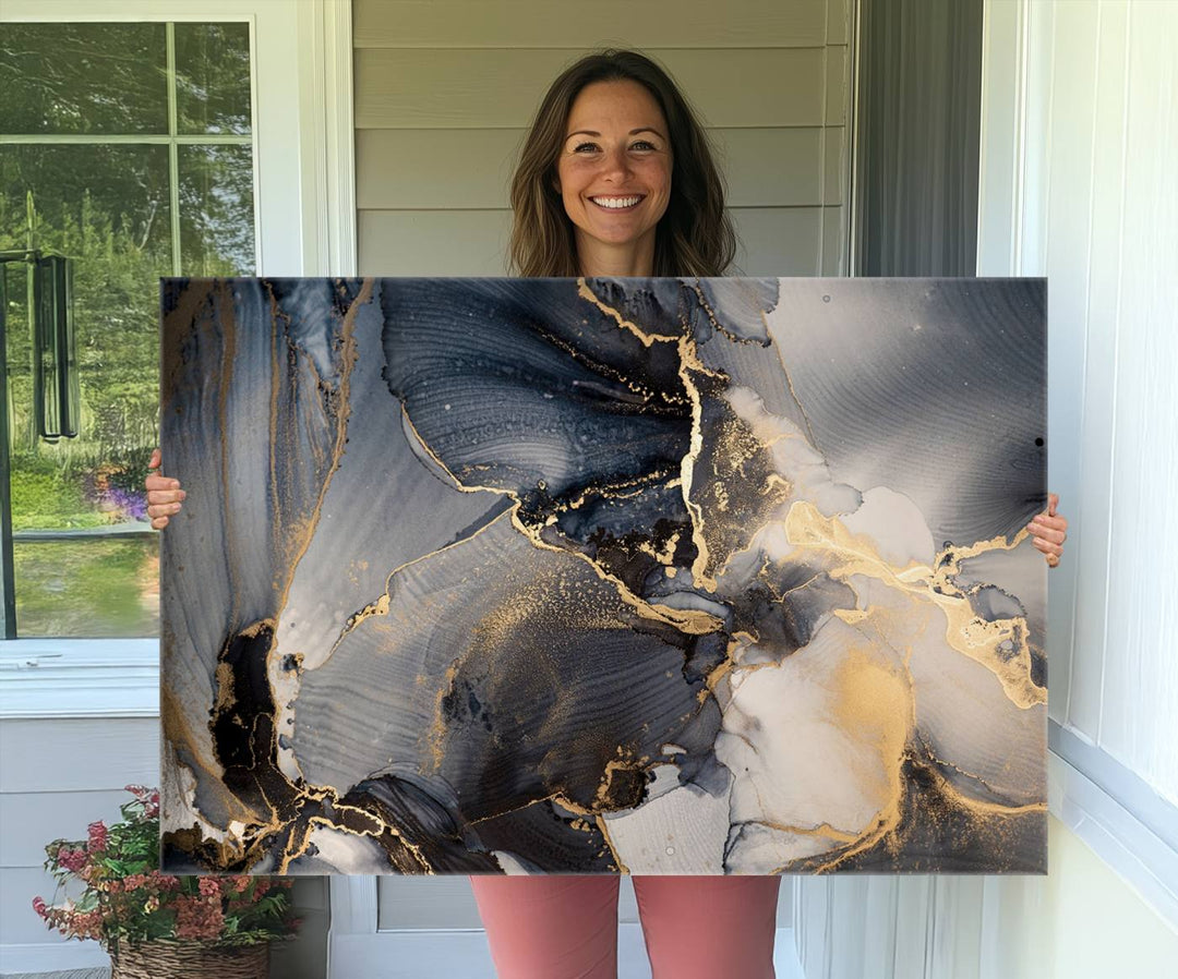 A Modern Marble Fluid Effect Abstract Wall Art with black, white, and gold swirls hangs in a modern kitchen.