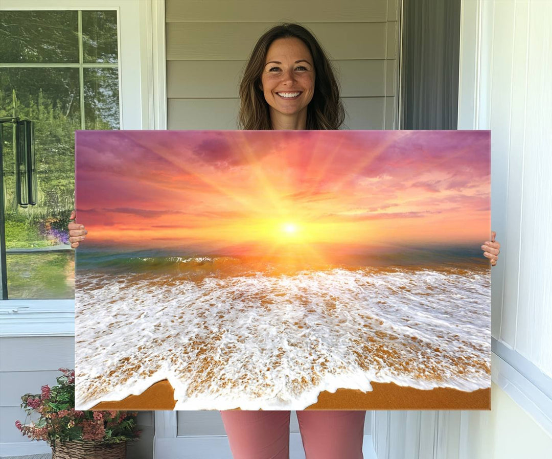 Golden Beach Sunrise 3-panel canvas art of ocean waves, hung on a wooden wall.