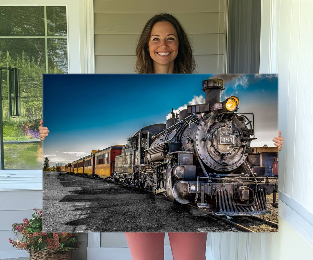 The Train Wall Art Canvas Print features a vintage steam train with a bright headlight.