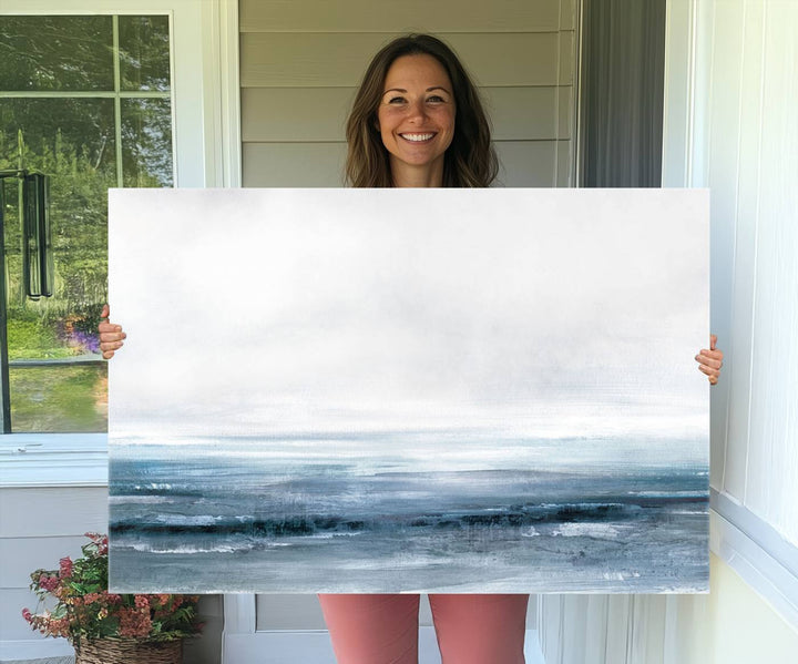 The dining area features Blue Ocean Abstract Artwork on canvas.