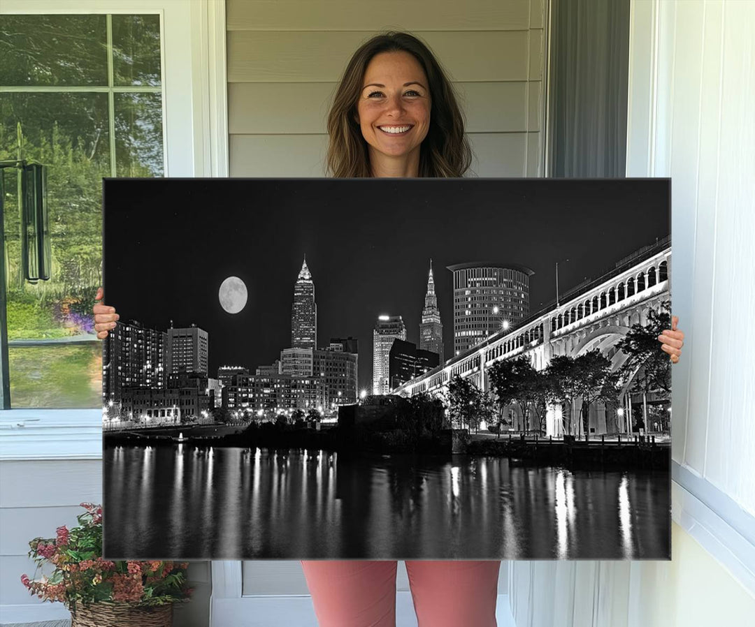 Cleveland Night Skyline Canvas Print: A museum-quality piece, ready to hang, featuring a stunning full moon and its reflections below.