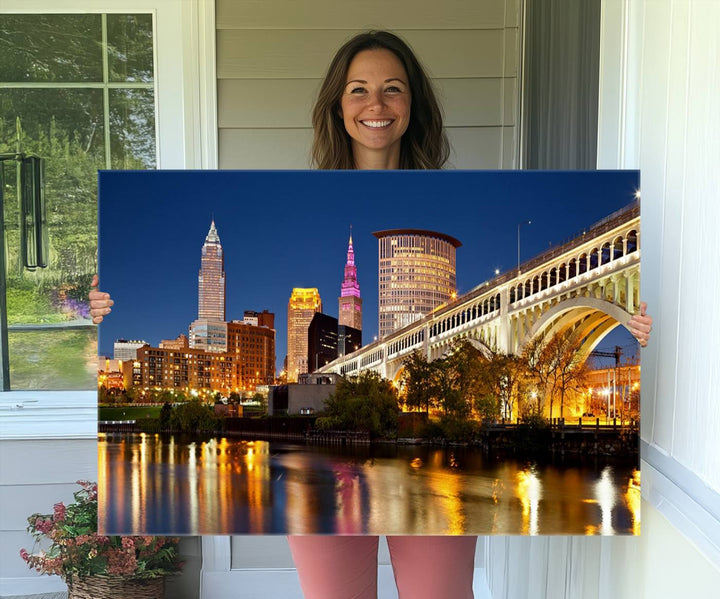 The Cleveland City Lights Canvas showcases a lit-up bridge and cityscape at night.