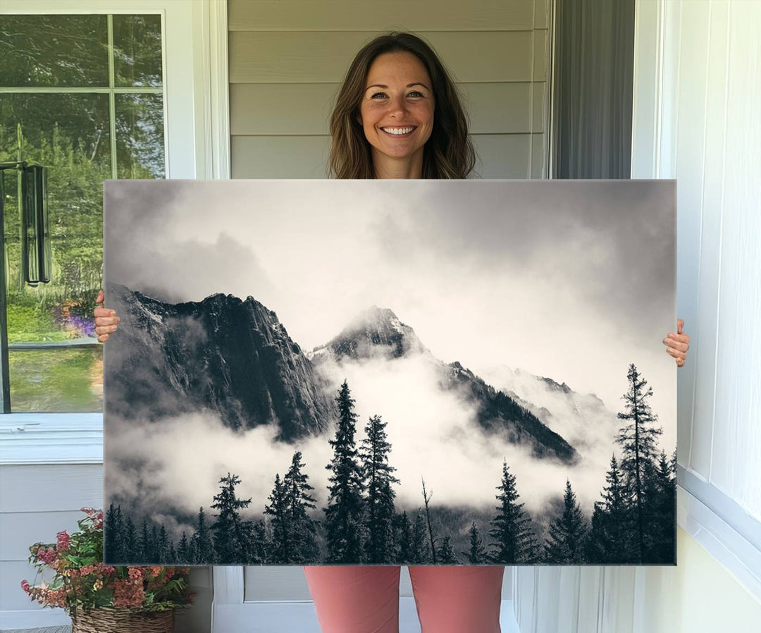 A large foggy mountain forest canvas print hangs prominently in the room.