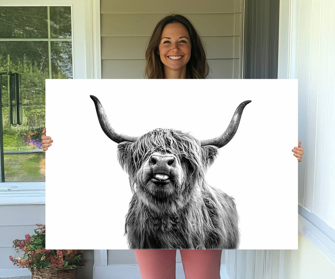 The Fanny Highland Cow art print decorates the modern kitchen, featured in black and white.