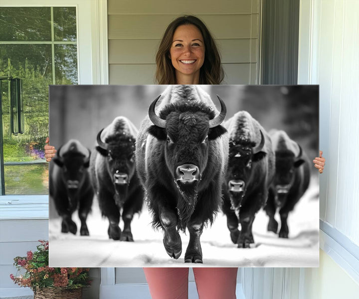 A black and white American Bison herd canvas print adorns the wall.