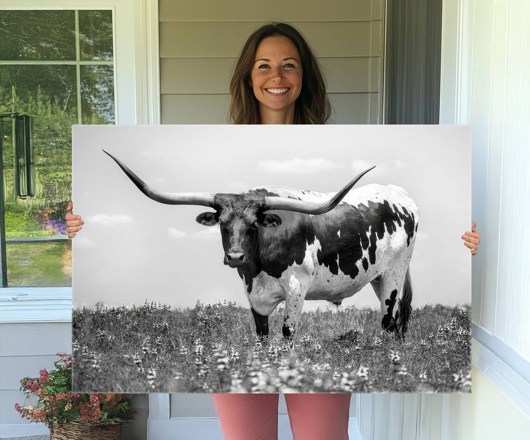 Texas Black White Highland Longhorn Cow Wall Art Canvas displayed on the wall.