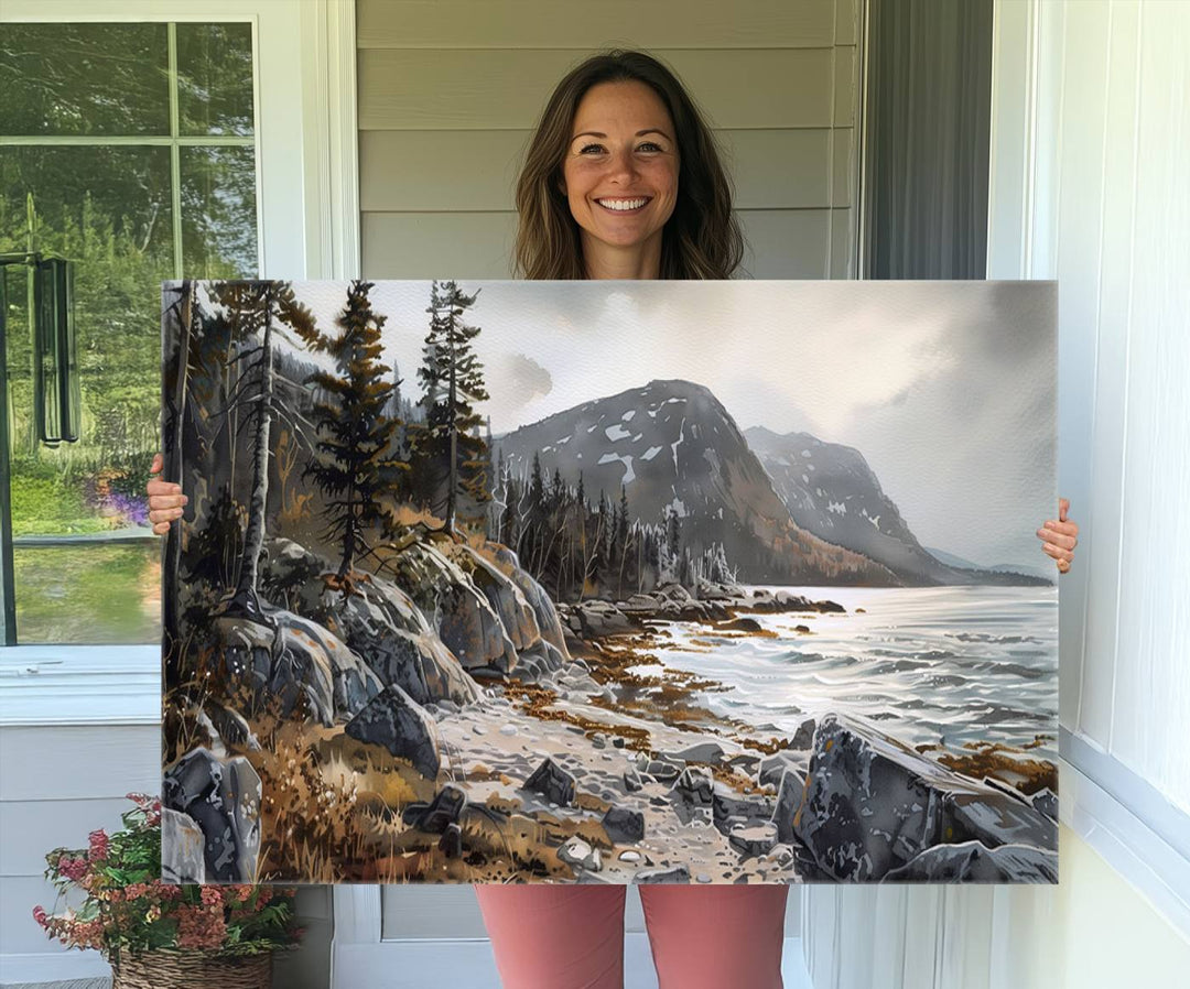 Framed wall art depicting Acadia National Parks rocky coast, trees, mountains, and sunlight over the sea; ready to hang.