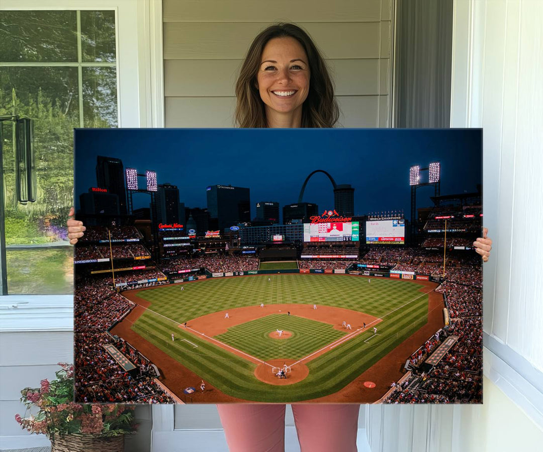 A St. Louis Cardinals Baseball Team print of Busch Stadium at night adorns the wall.