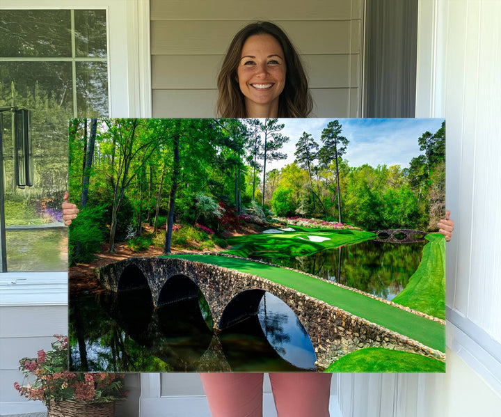 The wall art from Augusta National Golf Club showcases a panoramic bridge set against rich, lush greenery on a framed triptych canvas.