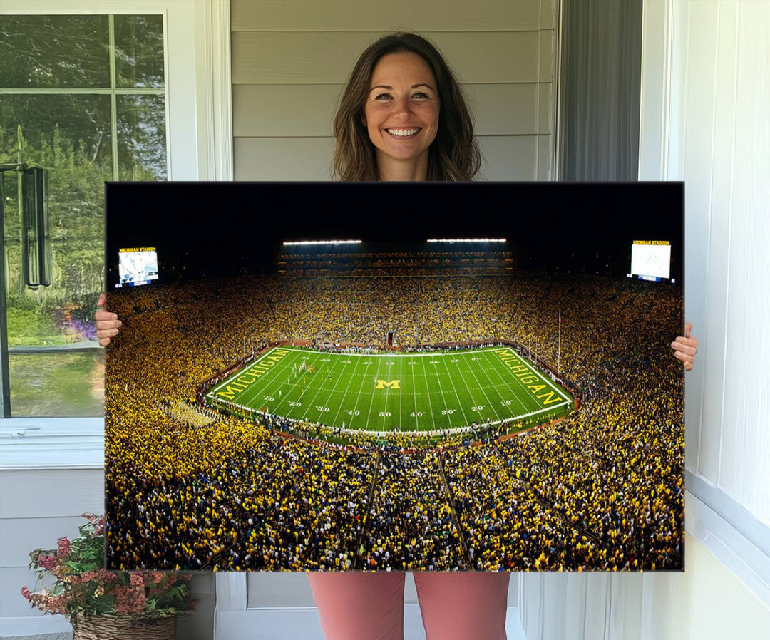 Aerial view of Michigan Stadium night game, ideal for Michigan Wolverines Football Team displayed on a triple canvas wall art.