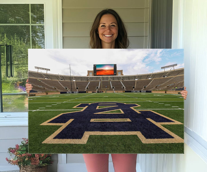 Notre Dame Stadium Triptych: This ready-to-hang giclee canvas print features a vibrant depiction of the football field adorned with an A logo and a stunning sunset.