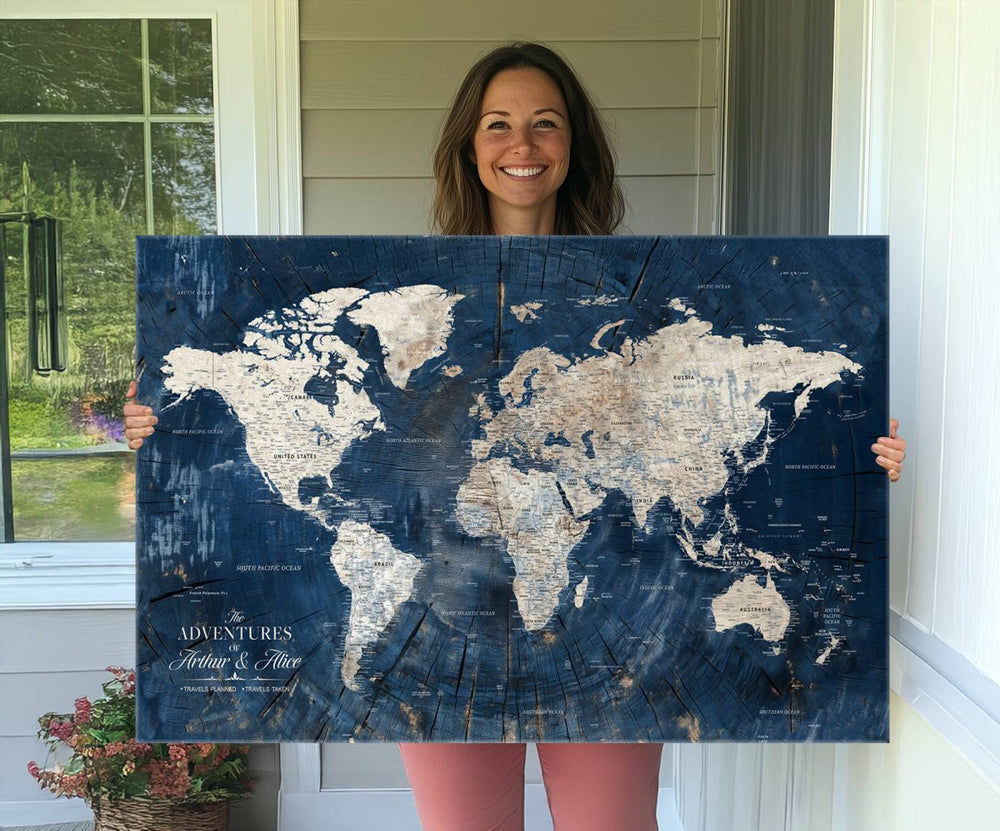 Personalized World Map Wall Art Print is displayed on a porch, with plants in the background.