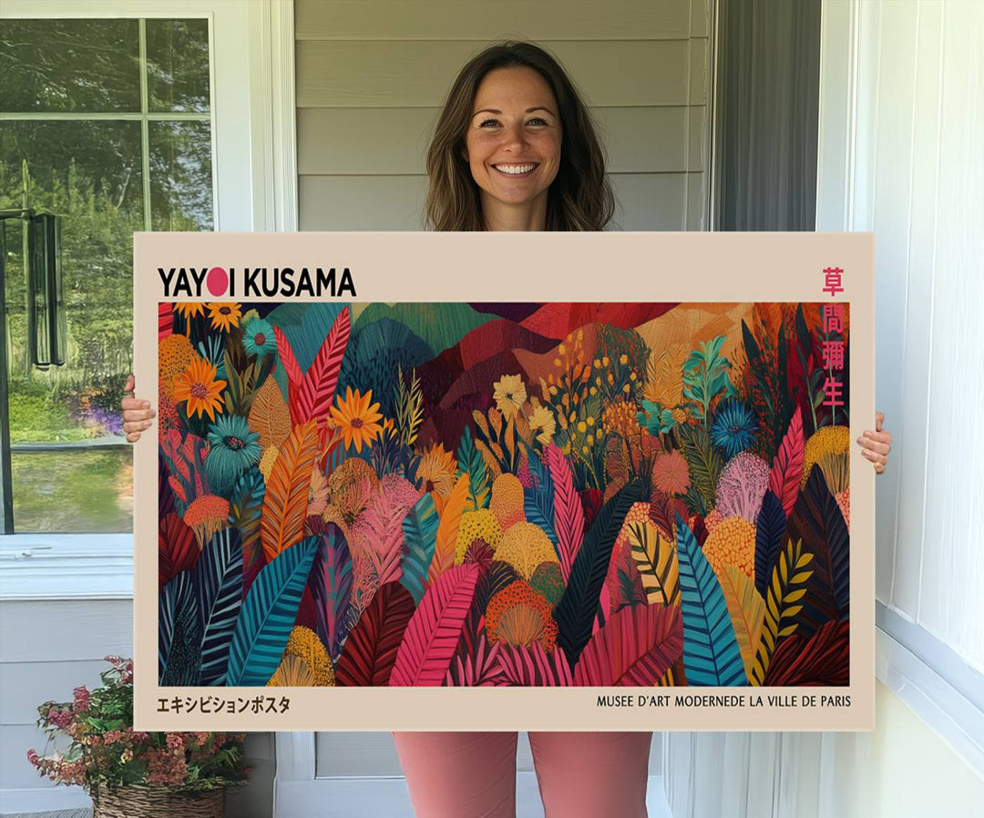 A Yayoi Kusama Wall Art Canvas Print is framed by a window and potted plant.