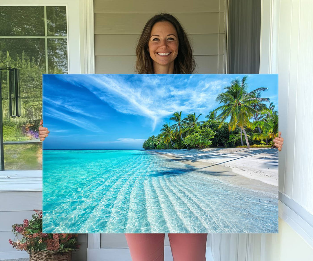 The Tropical Beach Wall Art Canvas Print showcases a serene ocean landscape with crystal clear turquoise water and palm trees, beautifully enhancing the coastal decor.