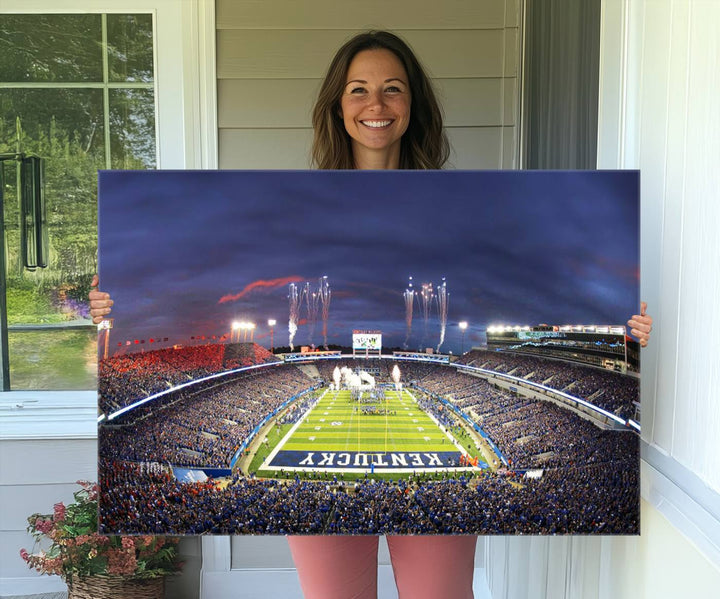 A filled stadium at dusk and fireworks overhead are beautifully captured in the Kroger Field Canvas Wall Art - Sunset Football Stadium Decor.