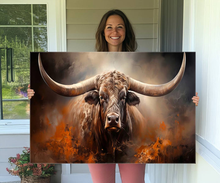 A Highland Bull with striking horns is depicted in a fiery abstract style on a ready-to-hang wall art canvas, evoking strength.