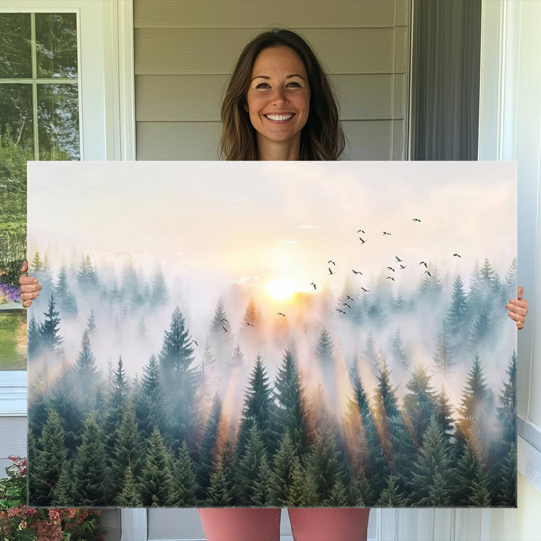 Misty Pine Forest Wall Art: A depiction of sunrise over foggy trees and birds against a bright sky; a framed woodland scene ideal for home or office decor.