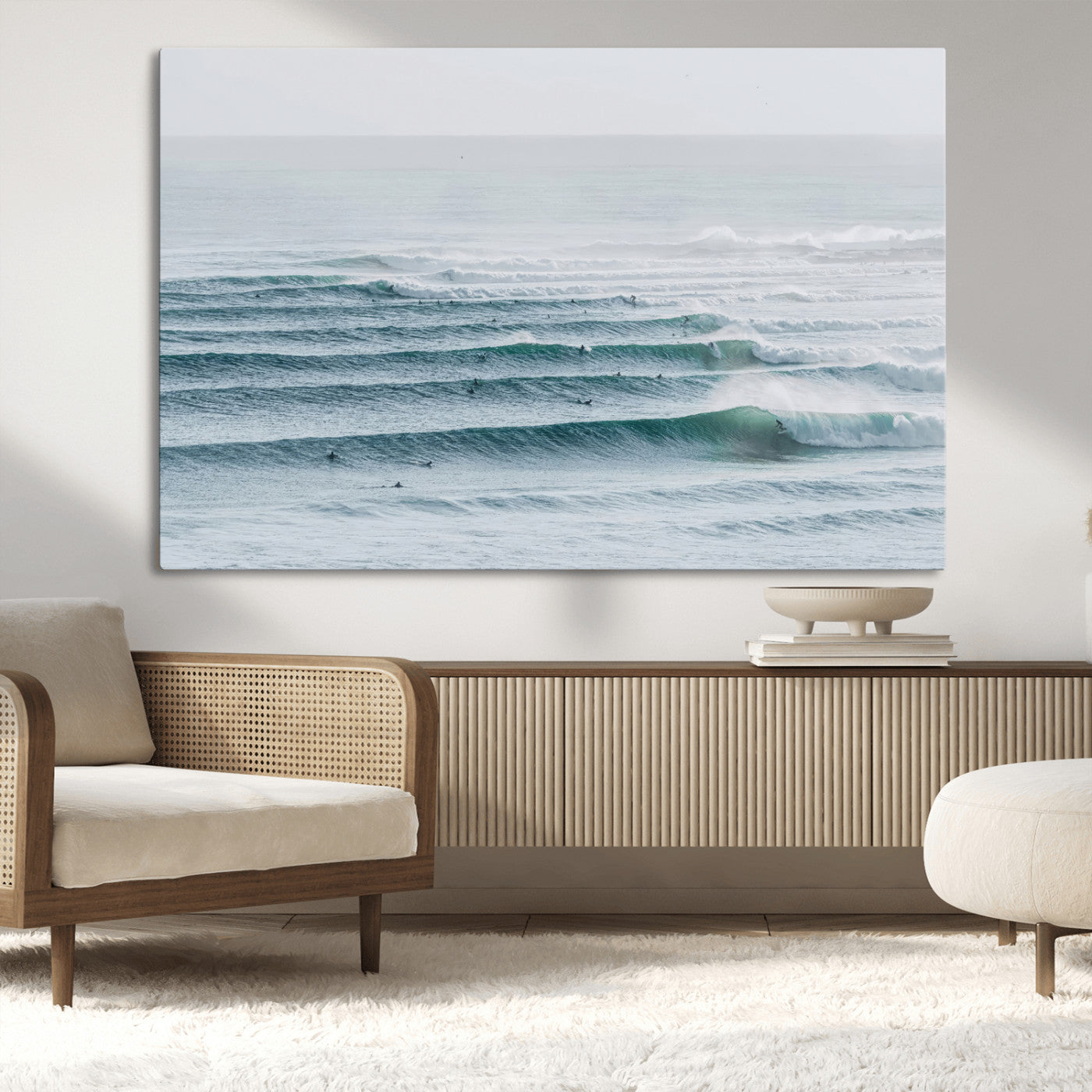 High-angle view of surfers lining up across layered ocean waves, ideal for minimal coastal or surf-inspired room decor.