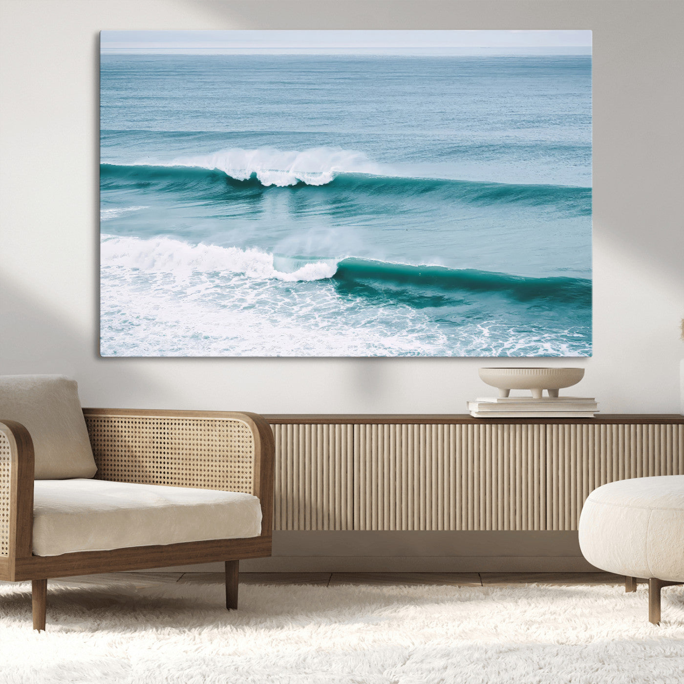 Powerful ocean waves rolling towards the shore, their turquoise hues blending with white sea foam under an open horizon, capturing the essence of the ocean's movement.