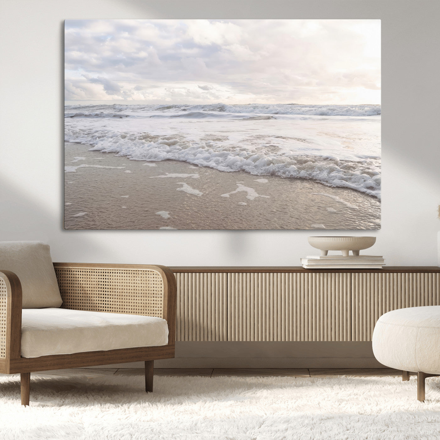 Peaceful ocean waves rolling onto the sandy shore under soft light, perfect for neutral or coastal minimalist decor themes.
