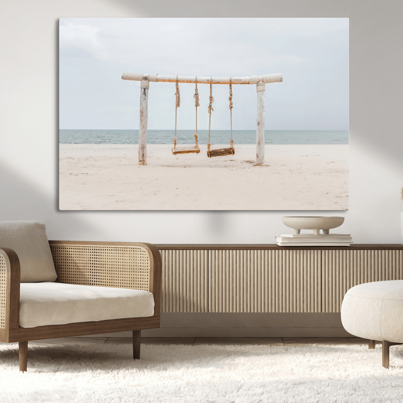 A rustic wooden beach swing stands on a serene sandy shore with an ocean horizon in the background, creating a tranquil and dreamy coastal escape.