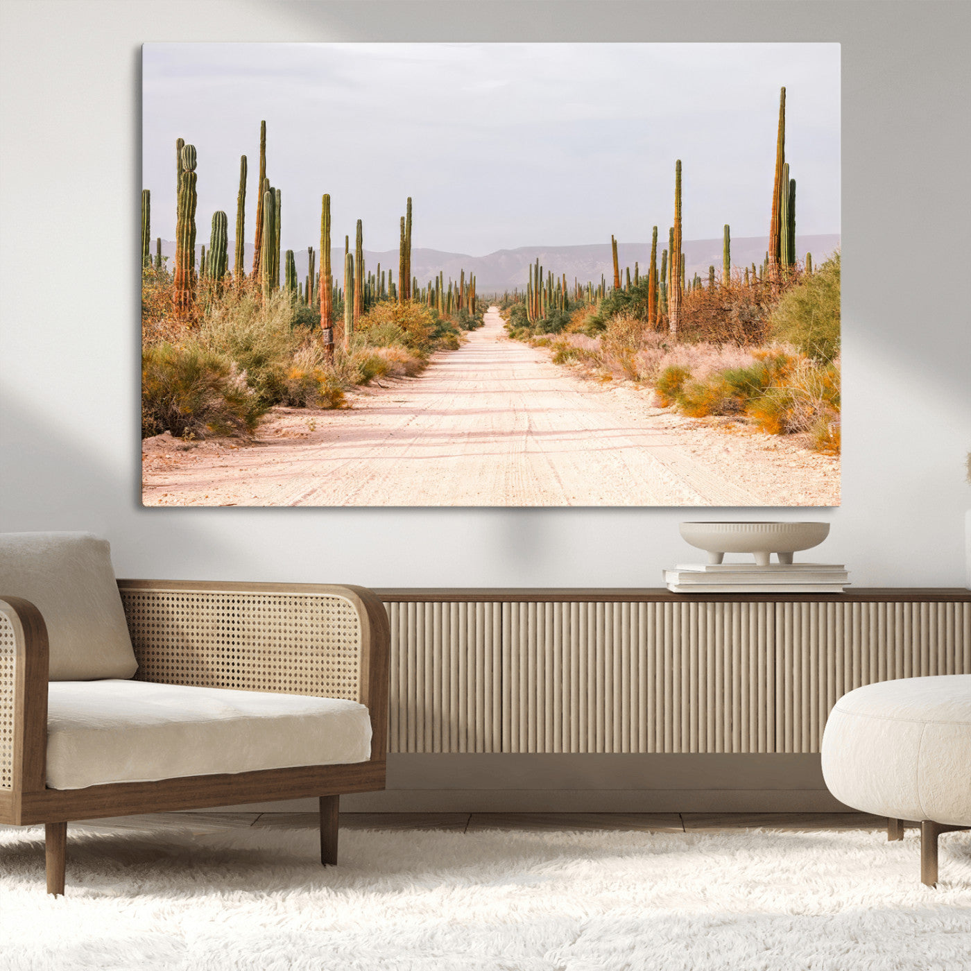 A desert road lined with saguaro cacti under a golden sky, creating a warm southwestern feel, perfect for boho or rustic decor.