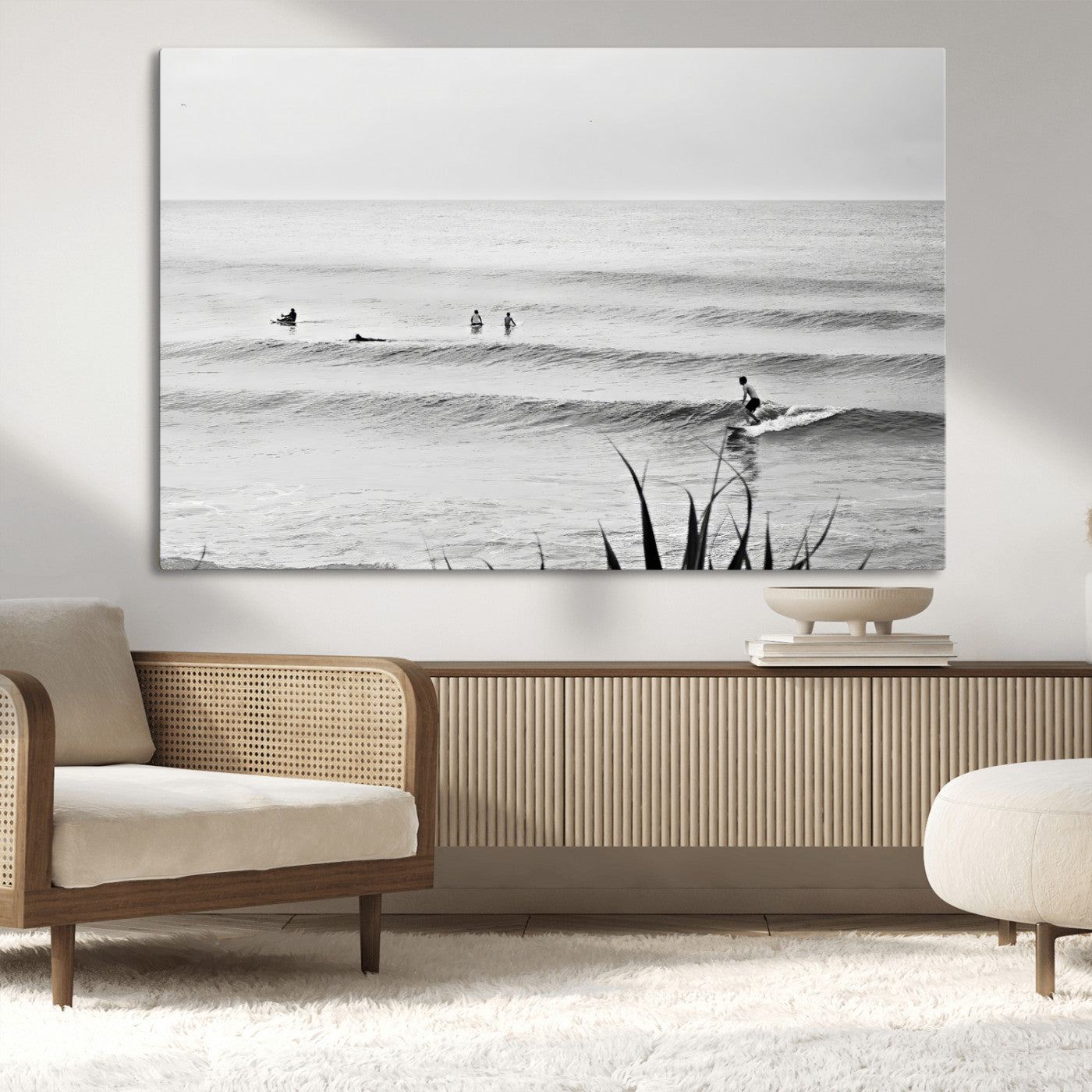 Monochrome canvas of surfers on calm ocean waves, ideal for minimalist coastal or beach-inspired interior decor.