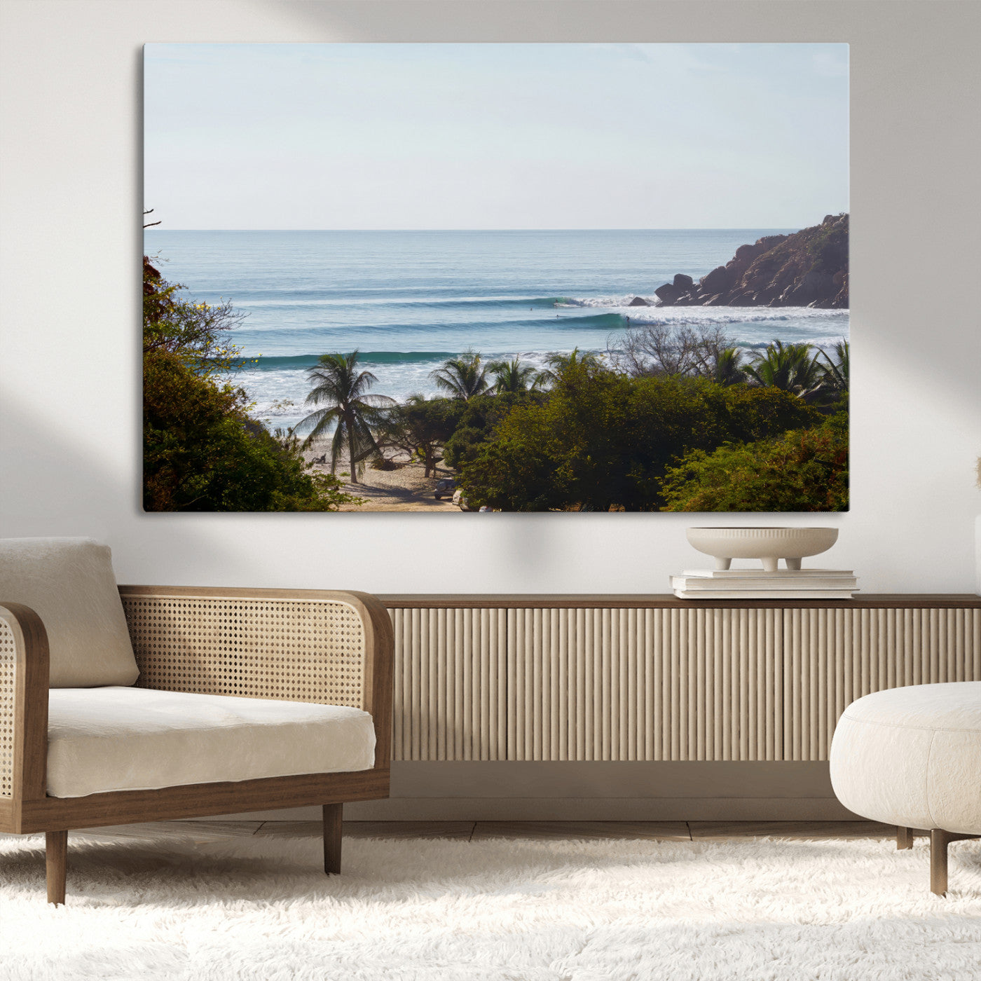 View of calm ocean waves with palm trees and a tropical coastline, ideal for coastal boho or beach-themed wall decor.