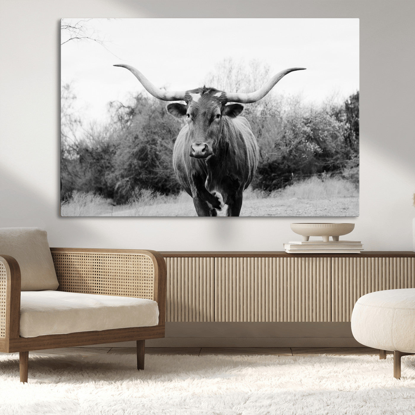 Black and white photo of a Longhorn cow facing camera, ideal for rustic, farmhouse, or western-themed home wall decor.