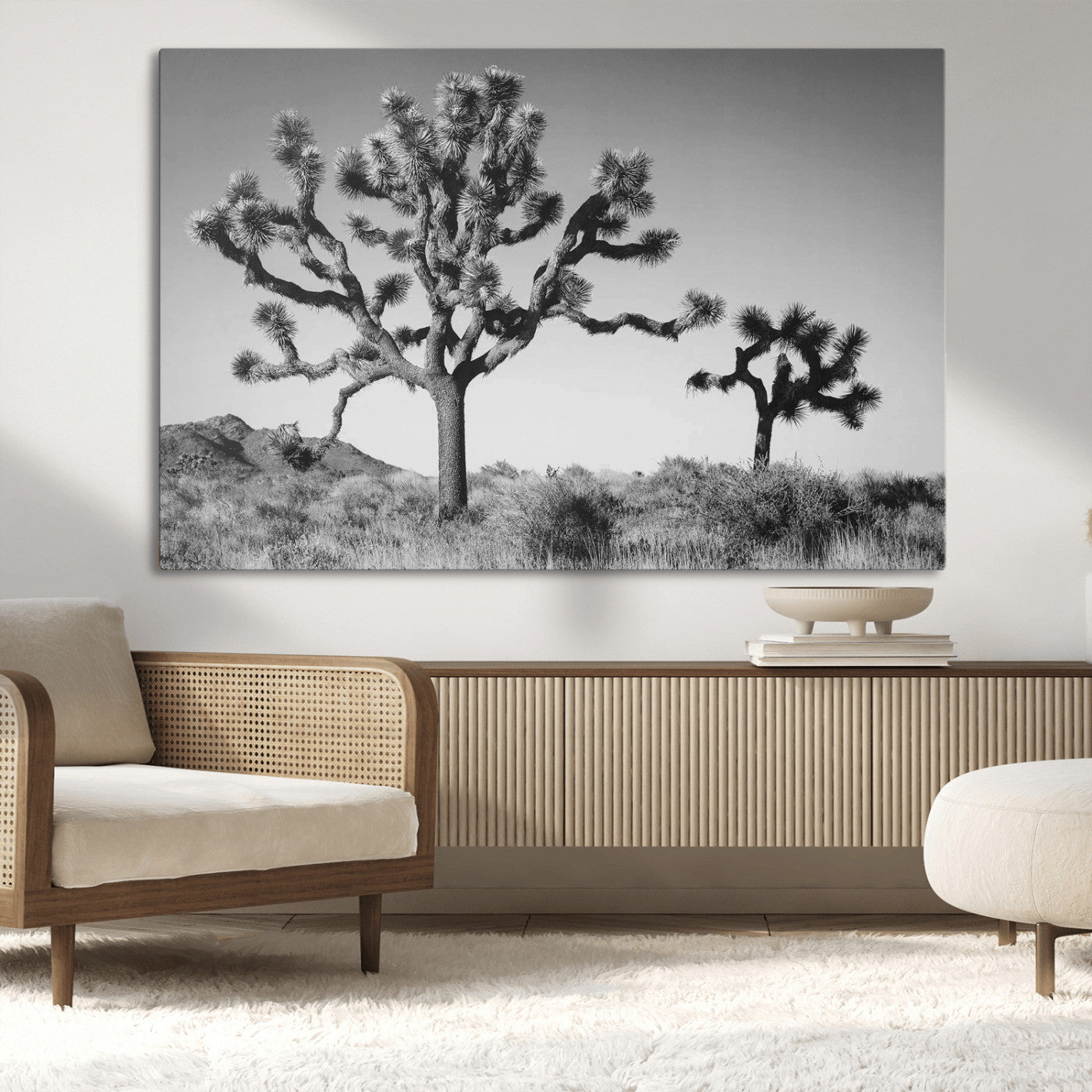 Black and white desert scene with two Joshua trees under clear sky, perfect for rustic or boho-inspired home decor.