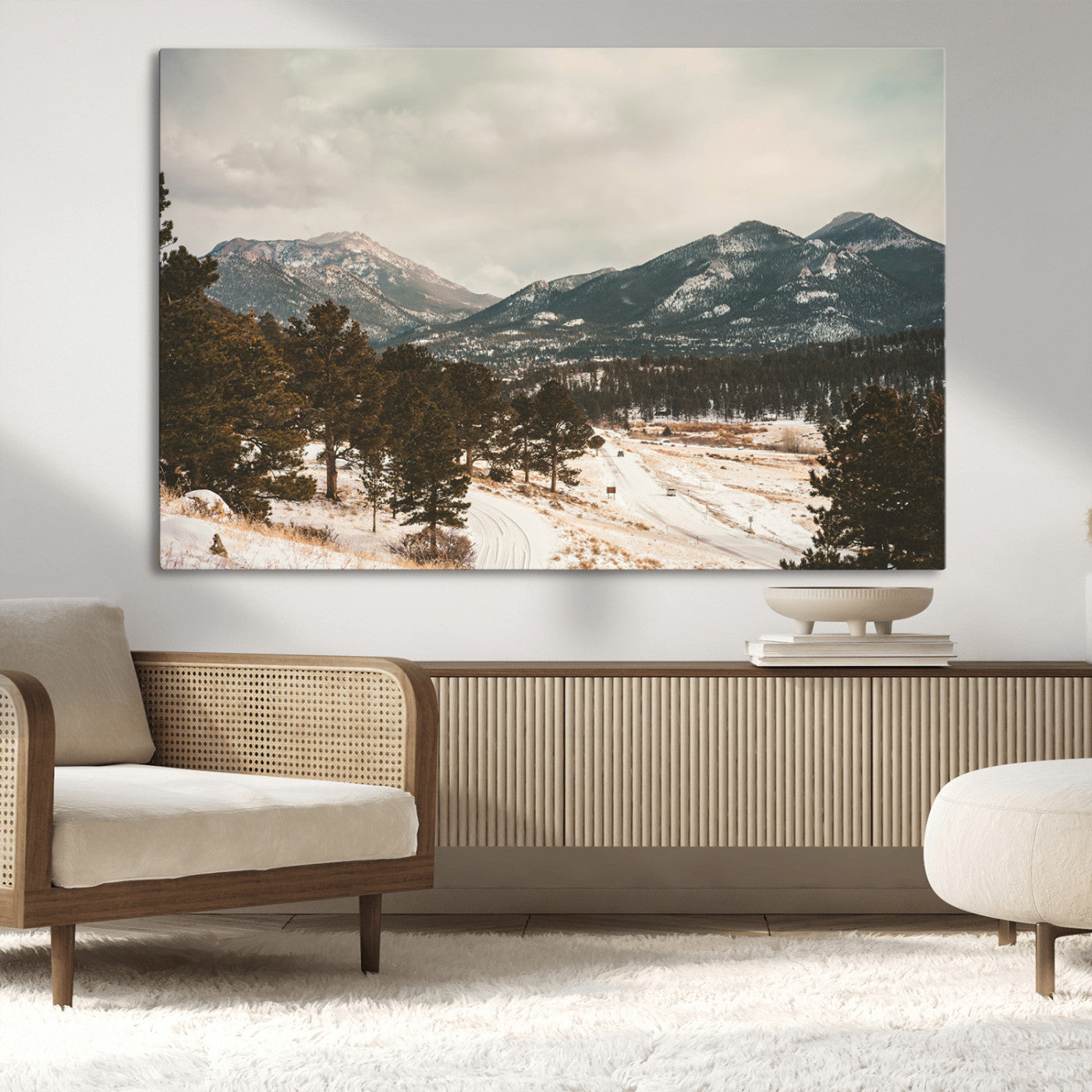 Snow-covered mountains with pine trees and a winding path, creating a serene and rustic winter landscape perfect for cozy decor.