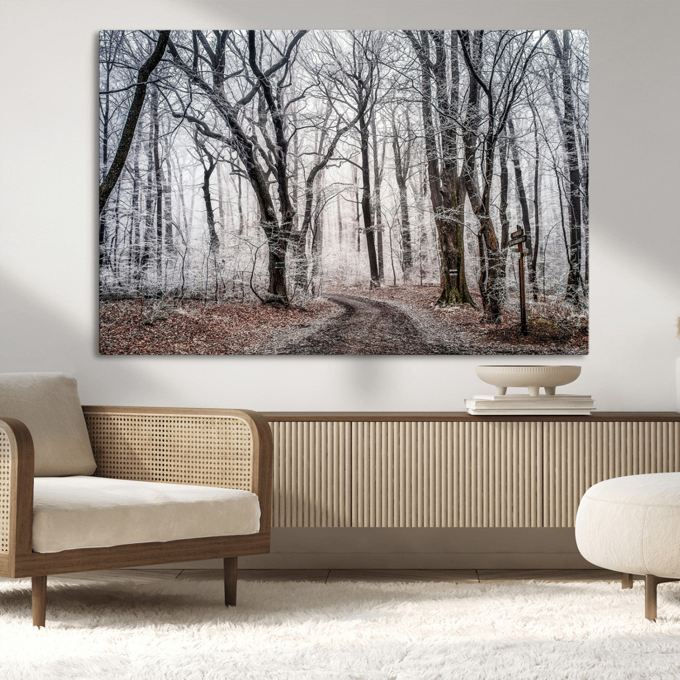 Snow-covered trees in a misty winter forest with a winding path, creating a serene and mysterious atmosphere, perfect for nature-inspired wall art.